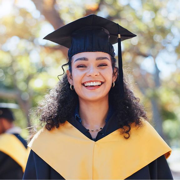 A woman graduate in cap and gown
