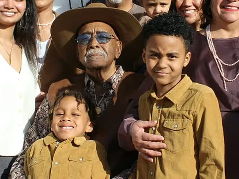 Two cousins in matching golden shirts
